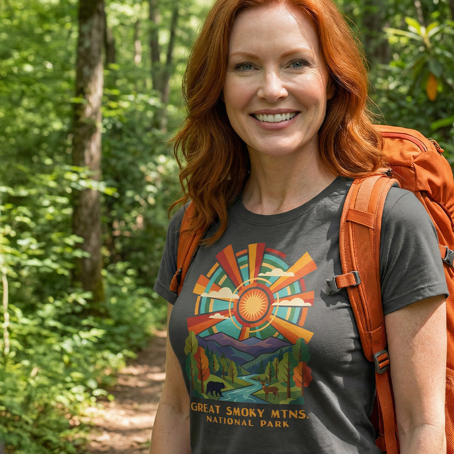Model wearing radiant sunburst Great Smoky Mountains National Park Charcoal T-Shirt hiking.
