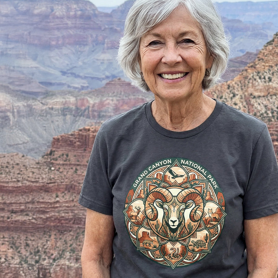 Senior Woman wearing a charcoal Grand Canyon National Park mandala t-shirt  featuring wildlife found in Grand Canyon and Arizona.
