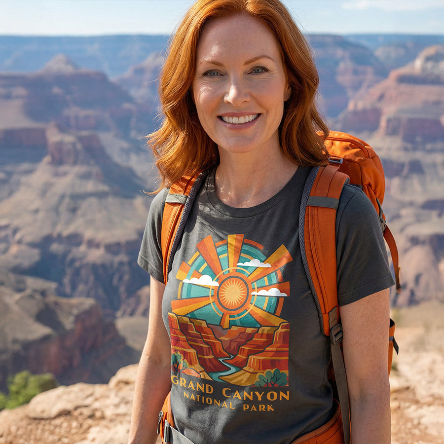 Model wearing radiant sunburst Grand Canyon National Park Charcoal T-Shirt hiking.