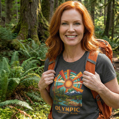 Model wearing radiant sunburst Olympic National Park Charcoal T-Shirt hiking.