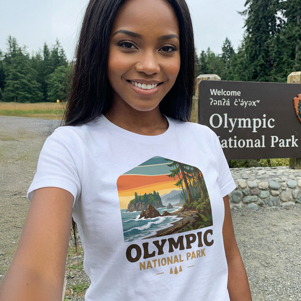 Model wearing Olympic National Park Badge graphic on a white t-shirt.