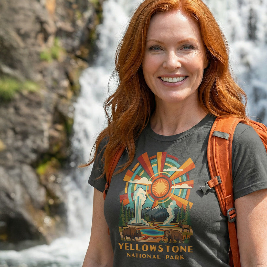 Model wearing radiant sunburst Yellowstone National Park Charcoal T-Shirt hiking.