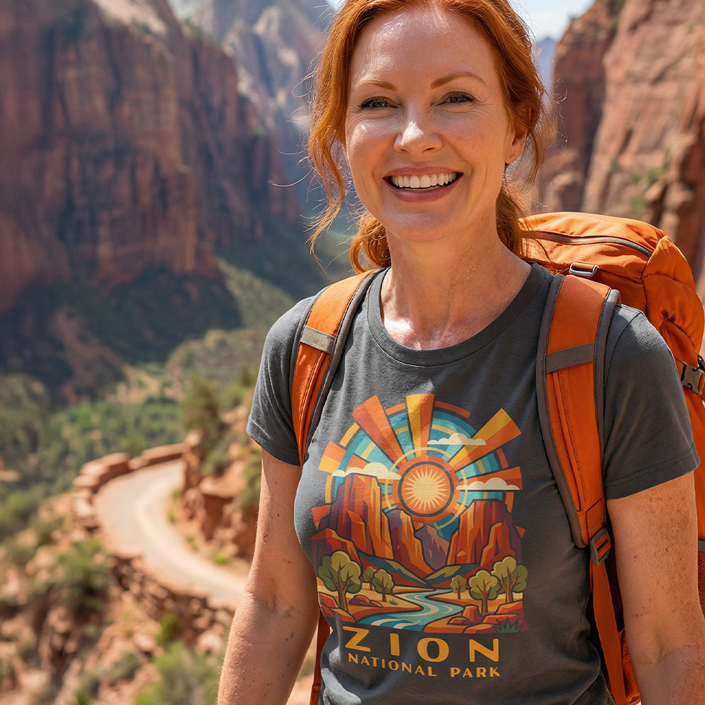 Model wearing radiant sunburst Zion National Park Charcoal T-Shirt hiking Angels Landing.