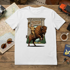 Teddy Roosevelt riding a Bison in front of Yellowstone Arch on a White T-Shirt.