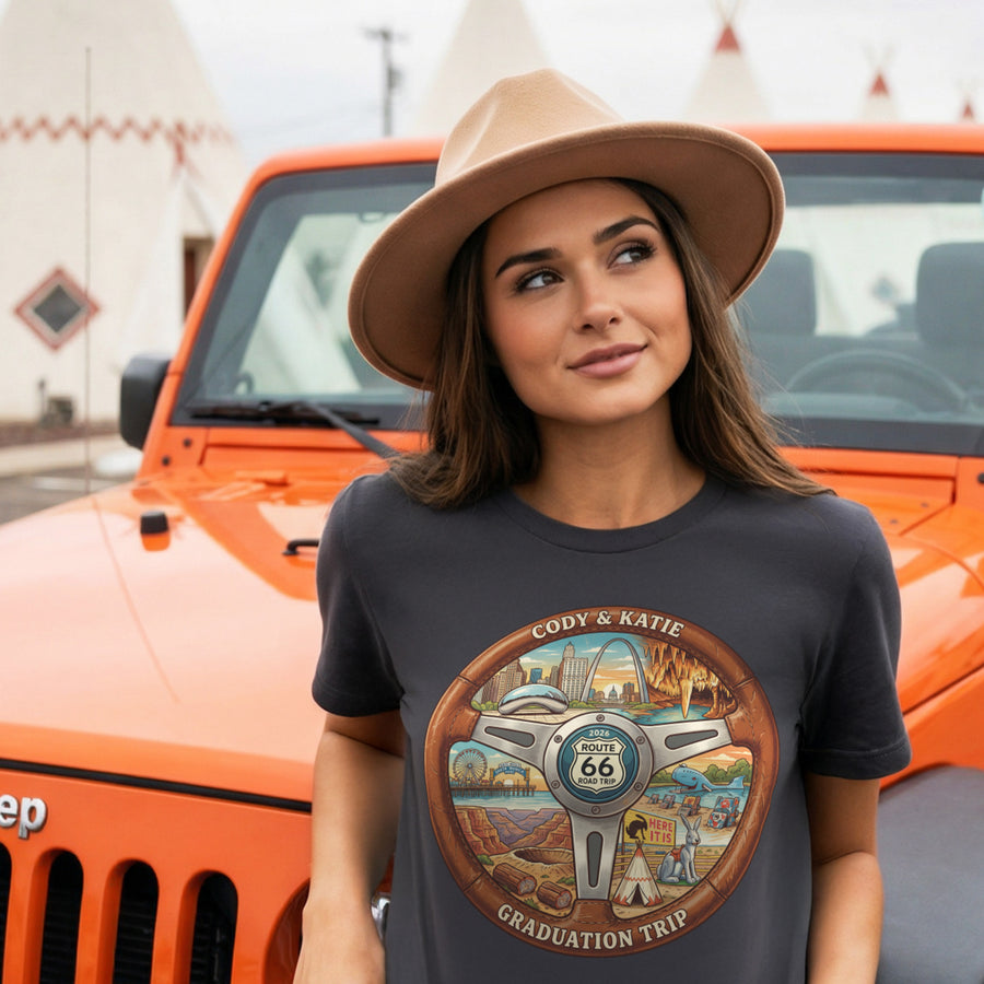 Woman wearing a t-shirt with a Route 66 design in front of an orange Jeep.